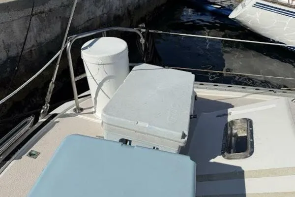 Slide: The Image of Deck of 1989 Catalina Morgan 440 sailboat with storage containers. - 7