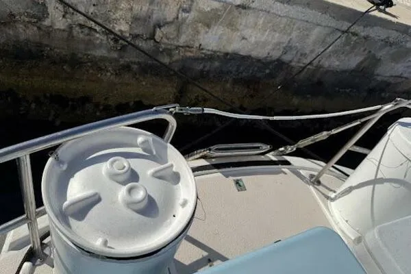 Slide: The Image of Deck view of 1989 Catalina Morgan 440 sailboat, featuring railing and winch. - 8