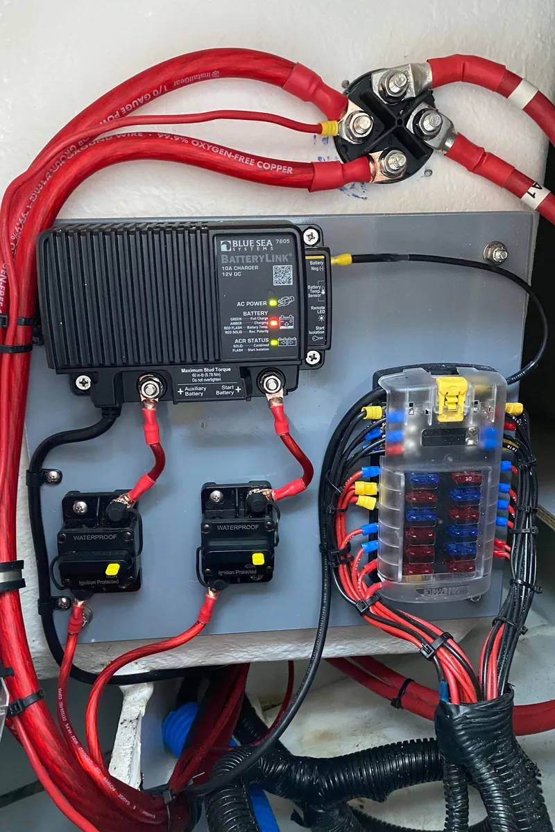 Slide: The Image of Electrical panel of 2020 Jeanneau NC Sport 695 boat with wiring and fuses. - 18