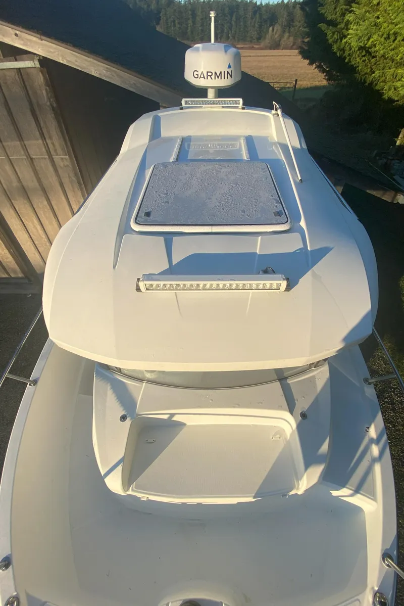 Slide: The Image of 2020 Jeanneau NC Sport 695 boat with Garmin equipment, viewed from above. - 6