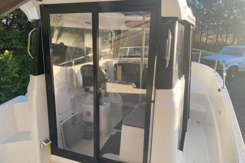 Slide: The Image of 2020 Jeanneau NC Sport 695 boat cabin with sliding glass doors. - 7