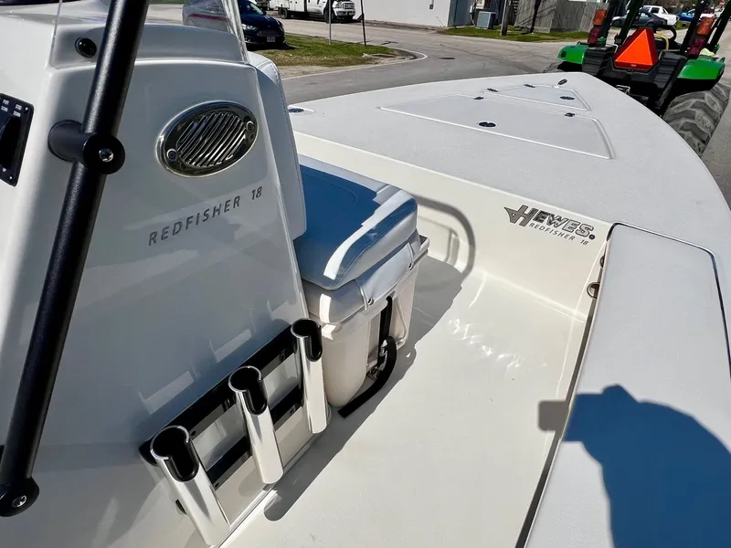 Slide: The Image of 2025 Hewes Redfisher 18 boat interior with rod holders and storage. - 13