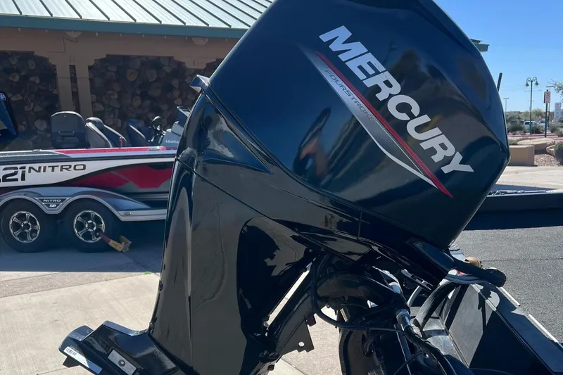 Slide: The Image of 2019 Ranger RT178 with Mercury outboard motor, parked near a Nitro boat. - 3