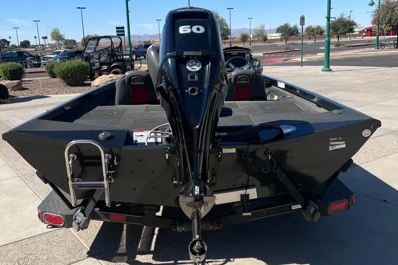 Slide: The Image of 2019 Ranger RT178 boat with 60 HP motor, parked outdoors. - 5