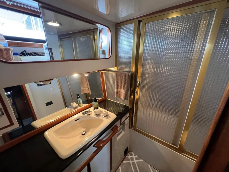 Slide: The Image of Bathroom interior of 1988 President Motor Yacht with sink and shower. - 11
