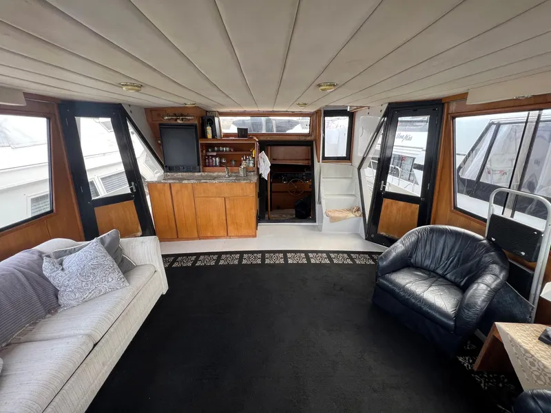 Slide: The Image of Luxurious interior of a 1988 President Motor Yacht with comfortable seating and elegant design. - 20