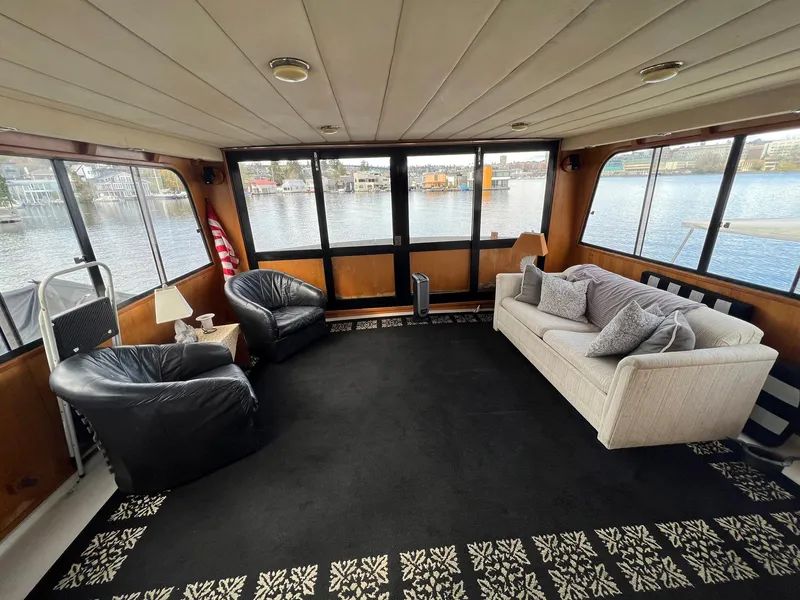 Slide: The Image of Interior of 1988 President Motor Yacht with plush seating and waterfront views. - 21