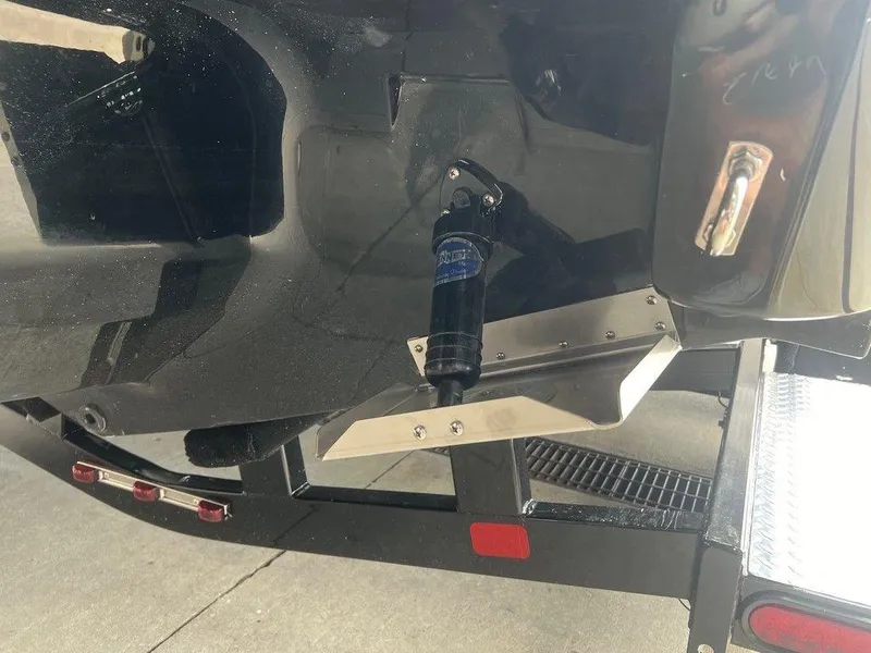 Slide: The Image of 2024 Regal LX4 boat trailer hitch and rear detail in close-up view. - 17