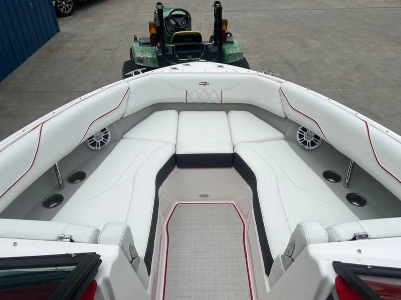 Slide: The Image of 2024 Regal LX4 boat interior with white seating and modern design. - 4