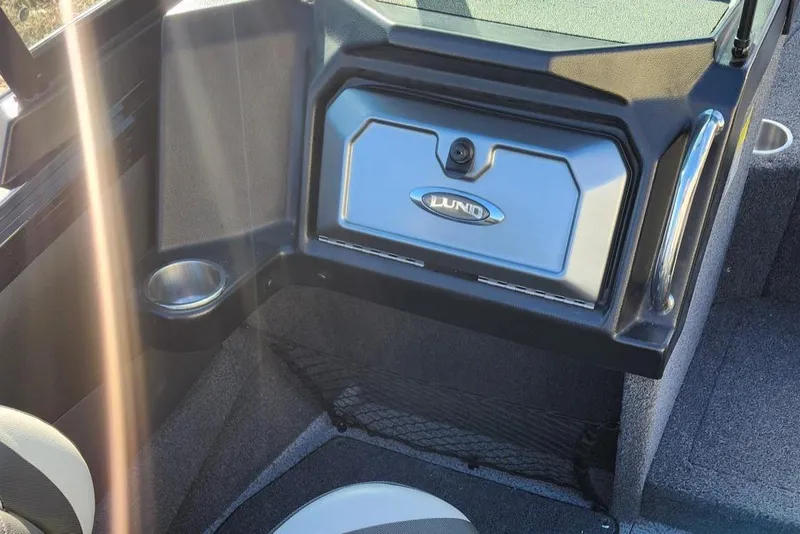 Slide: The Image of Interior of 2022 Lund 1975 Tyee Limited boat with storage compartment and cup holder. - 10