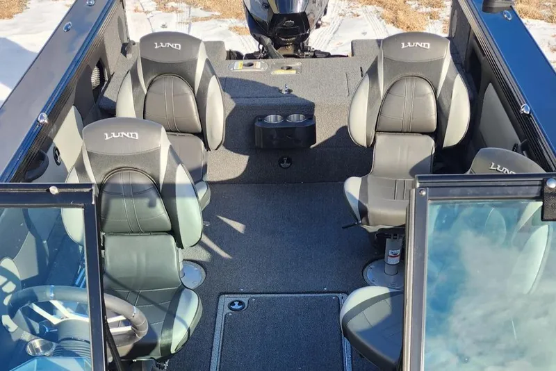 Slide: The Image of Interior of 2022 Lund 1975 Tyee Limited boat with four cushioned seats. - 12