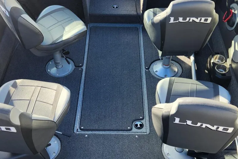 Slide: The Image of Interior of 2022 Lund 1975 Tyee Limited boat with four swivel seats. - 13