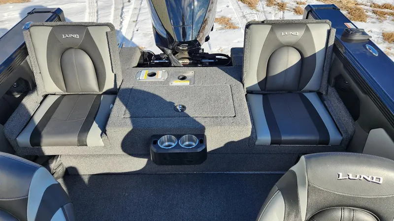 Slide: The Image of Interior of 2022 Lund 1975 Tyee Limited boat with gray seating and cup holders. - 3