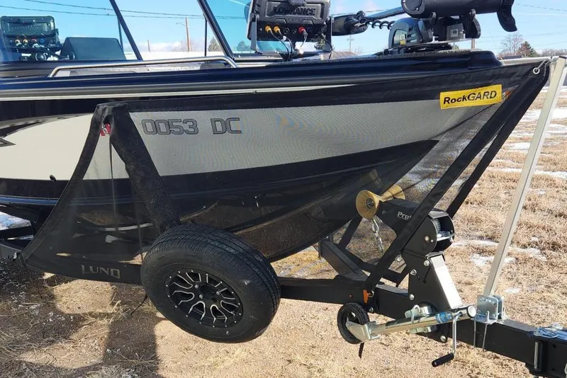 Slide: The Image of 2022 Lund 1975 Tyee Limited boat on trailer, featuring RockGARD protection. - 6