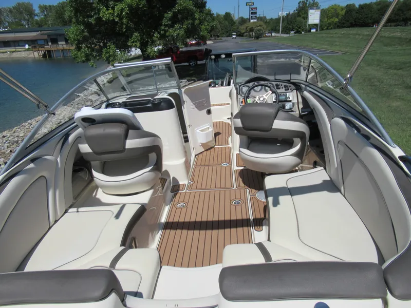 Slide: The Image of 2014 Yamaha Boats 242 Limited interior with spacious seating and sleek design. - 10