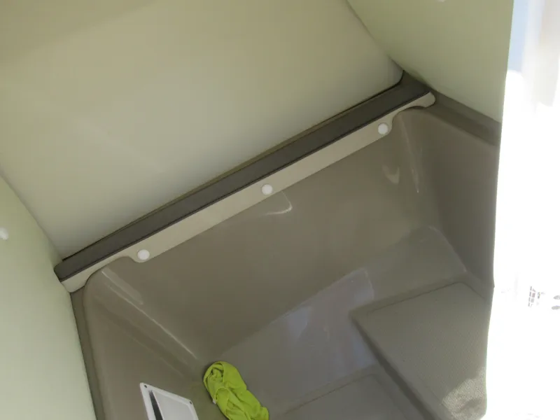 Slide: The Image of 2014 Yamaha Boats 242 Limited interior storage compartment. - 15