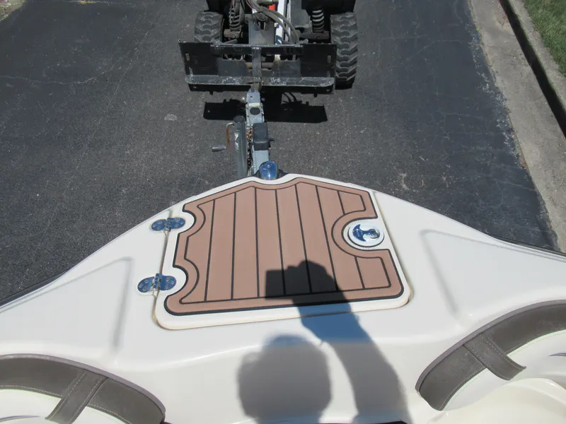 Slide: The Image of 2014 Yamaha Boats 242 Limited bow with trailer hitch on pavement. - 19