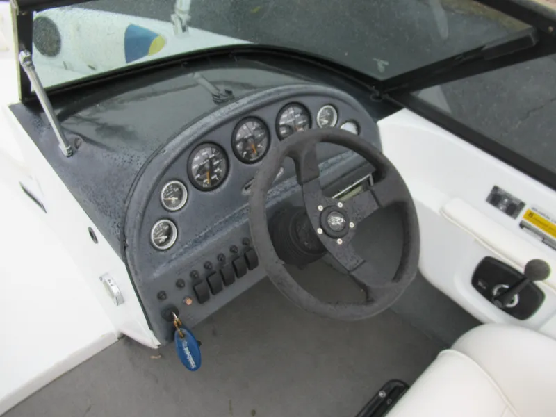 Slide: The Image of 2000 Moomba Outback LS dashboard with steering wheel and instrument panel. - 12