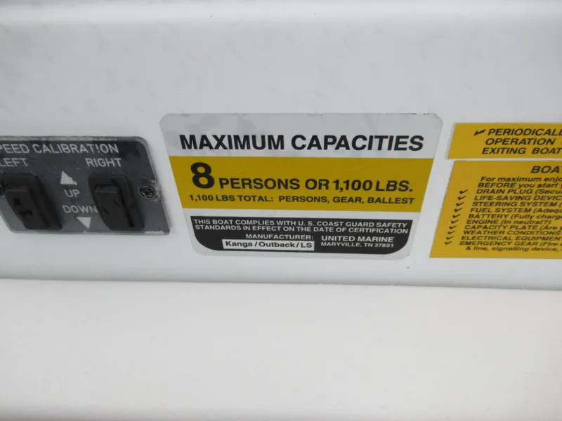 Slide: The Image of Maximum capacity label on 2000 Moomba Outback LS boat, 8 persons or 1,100 lbs. - 13