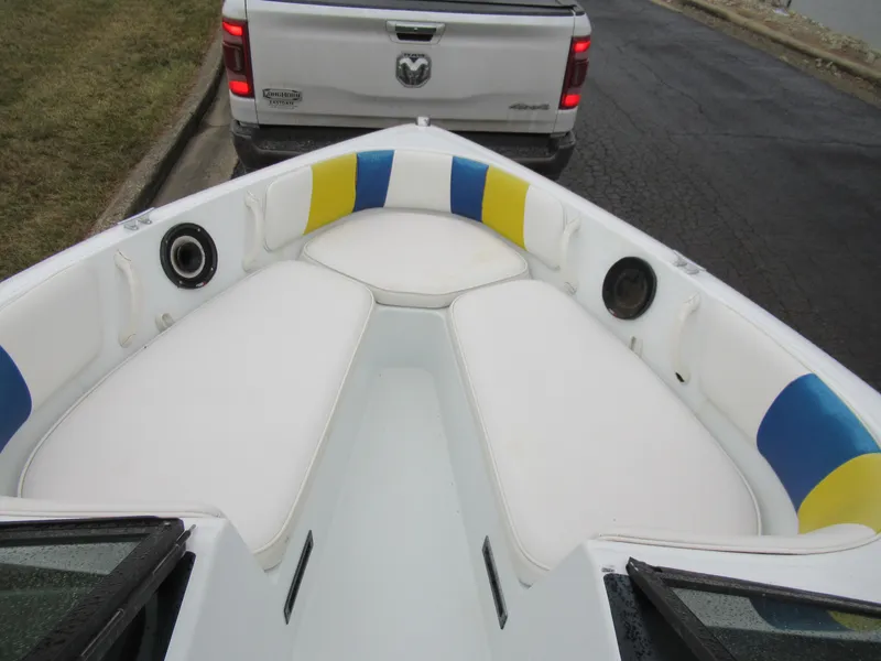 Slide: The Image of 2000 Moomba Outback LS boat interior with colorful seating and speakers. - 15
