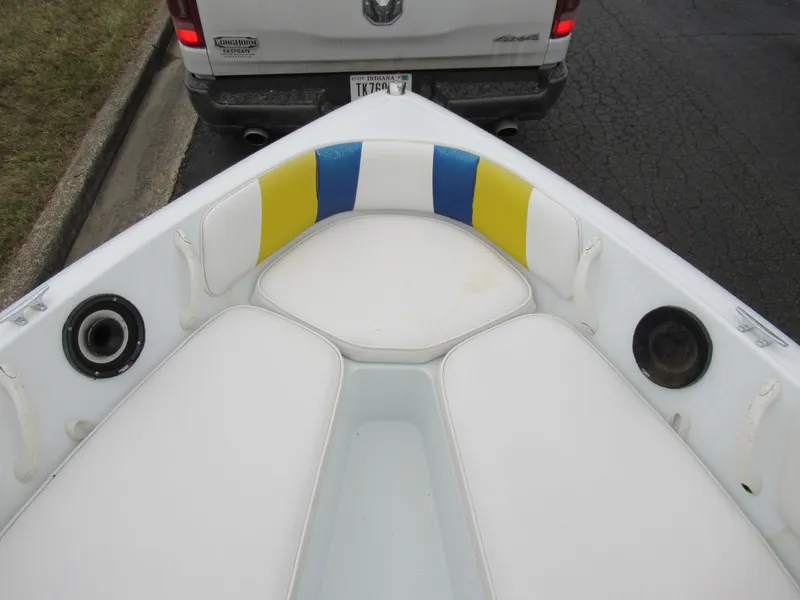 Slide: The Image of 2000 Moomba Outback LS boat interior with colorful seating and speakers. - 17