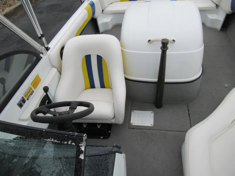 Slide: The Image of 2000 Moomba Outback LS boat interior with white and blue seating and steering wheel. - 20