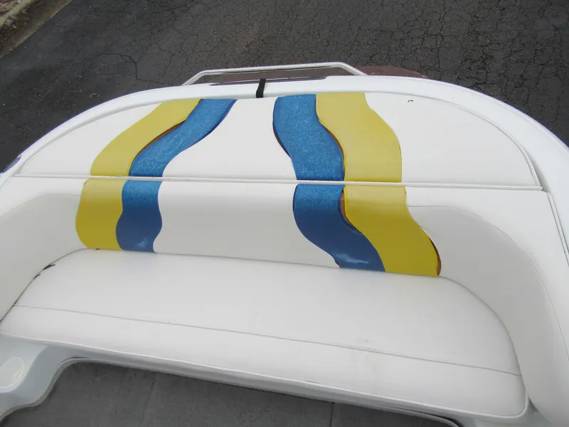 Slide: The Image of 2000 Moomba Outback LS boat seat with blue and yellow wave design. - 21
