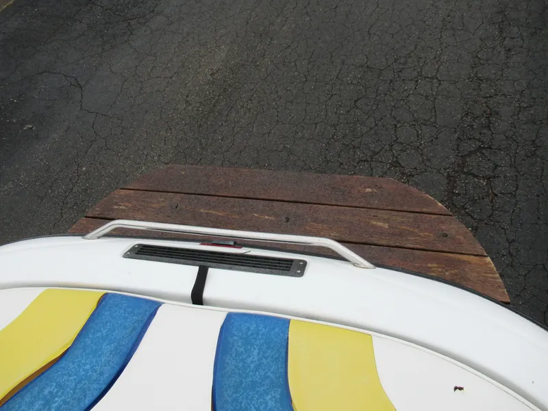 Slide: The Image of 2000 Moomba Outback LS boat with colorful seating and wooden swim platform. - 22