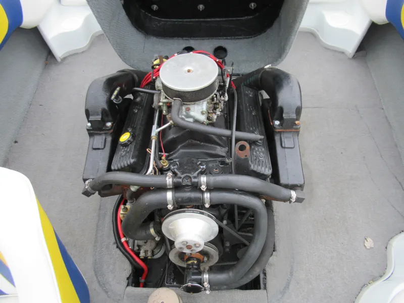 Slide: The Image of 2000 Moomba Outback LS engine compartment, showcasing the boat's inboard motor setup. - 23