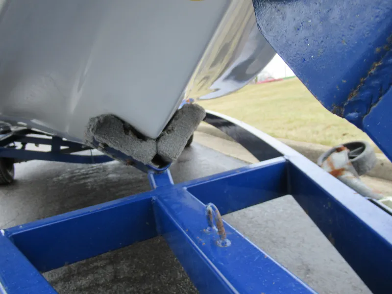 Slide: The Image of 2000 Moomba Outback LS boat on blue trailer, close-up view. - 7