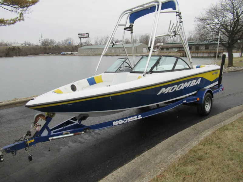 Slide: The Image of 2000 Moomba Outback LS boat on trailer by a lakeside. - 8