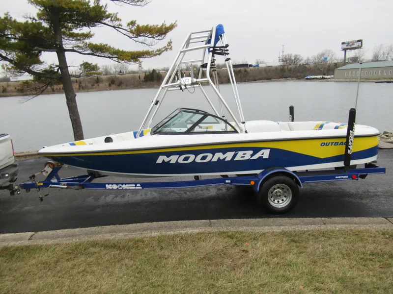 Slide: The Image of 2000 Moomba Outback LS boat on trailer by a lakeside. - 9