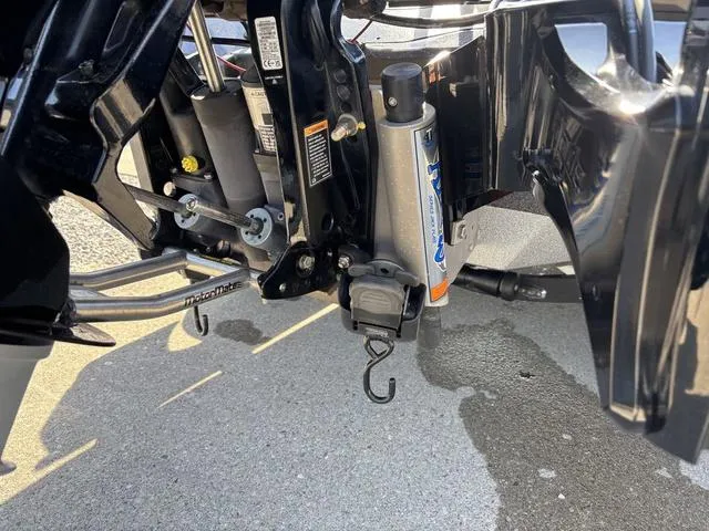 Slide: The Image of 2024 Ranger Z520R boat with Mercury Pro XS engine, parked outside a showroom. - 3