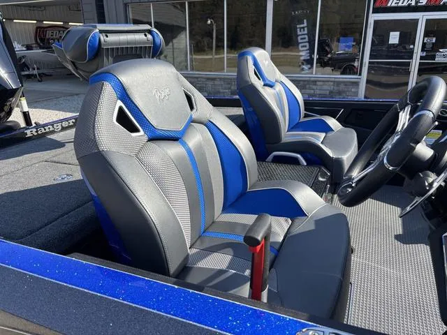 Slide: The Image of 2024 Ranger Z520R boat with advanced navigation equipment and sleek design in a dealership setting. - 6
