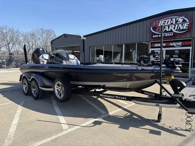 Slide: The Image of 2024 Ranger Z520R boat with advanced fishing equipment at a marine store. - 8