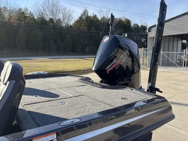 Slide: The Image of 2024 iKon LX20 boat with Mercury Pro XS engine, parked outdoors. - 16