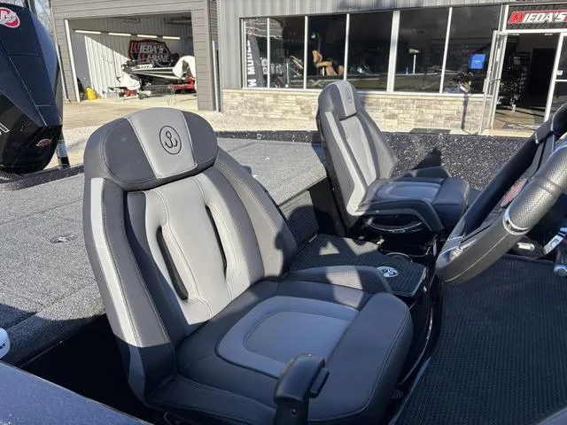 Slide: The Image of 2024 iKon LX20 boat interior with two gray and black seats. - 7