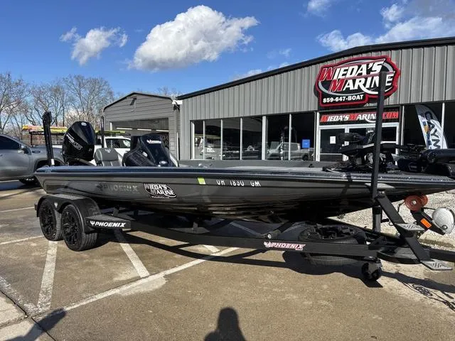 Slide: The Image of 2024 Phoenix 921 Elite II boat parked at Wieda's Marine dealership. - 10