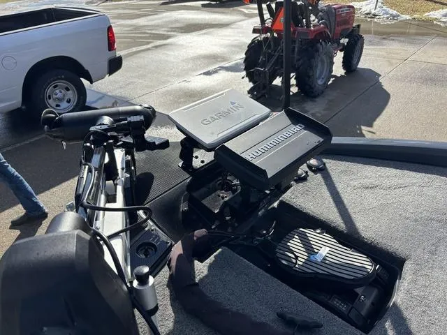 Slide: The Image of 2024 Phoenix 921 Elite II boat with Garmin and Humminbird electronics on deck. - 13