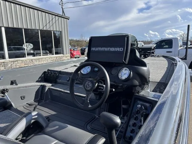 Slide: The Image of 2024 Phoenix 921 Elite II boat interior with Humminbird electronics, steering wheel, and dashboard controls. - 6