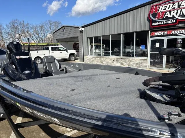 Slide: The Image of 2024 Phoenix 921 Elite II boat at Weda's Marine dealership, exterior view. - 9