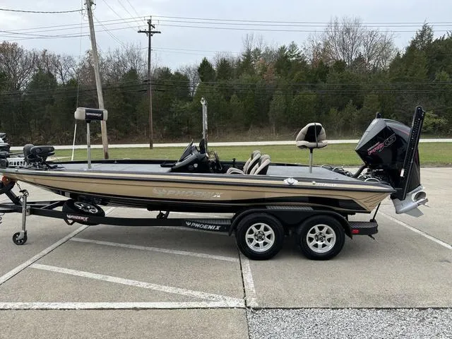 Slide: The Image of 2023 Phoenix 721 Pro XP boat on trailer in parking lot. - 22