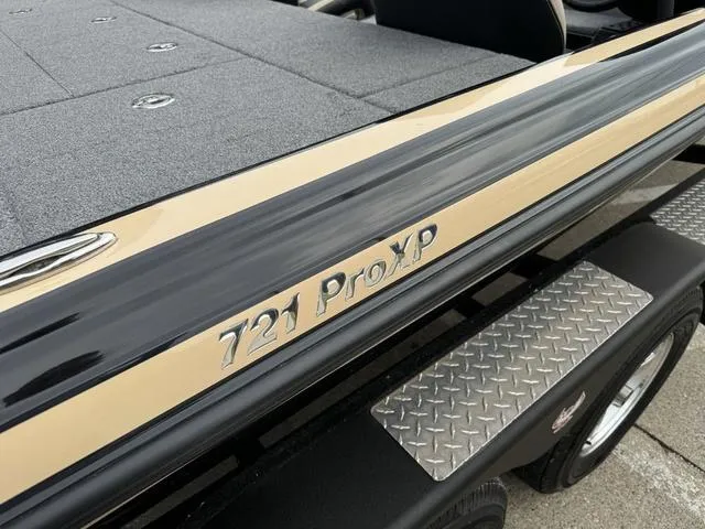 Slide: The Image of 2023 Phoenix 721 Pro XP boat, close-up of model name on sleek exterior. - 6