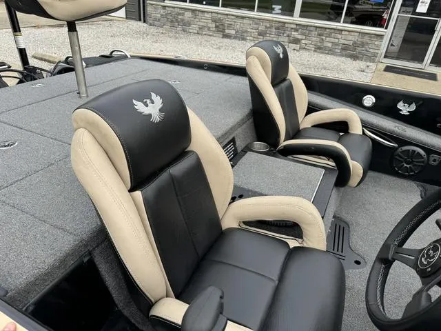 Slide: The Image of 2023 Phoenix 721 Pro XP boat interior with black and beige seats. - 9