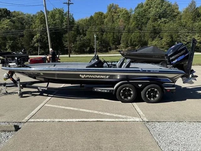 Slide: The Image of 2017 Phoenix 921 PRO XP bass boat on trailer, parked outdoors. - 17