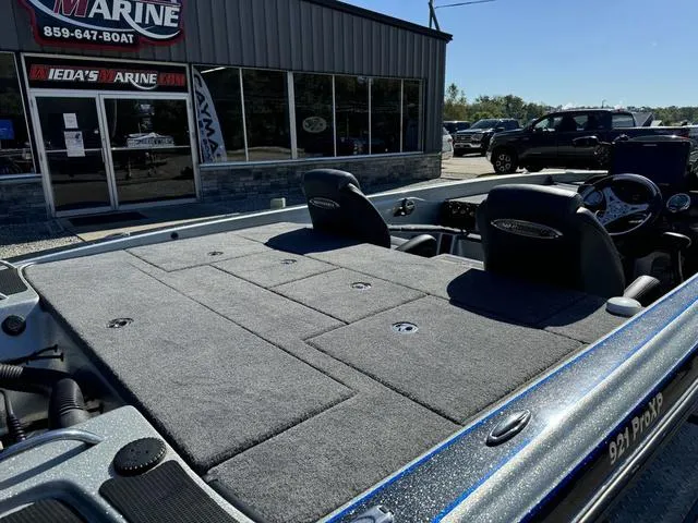 Slide: The Image of 2017 Phoenix 921 PRO XP boat at dealership, showcasing spacious deck and seating. - 4