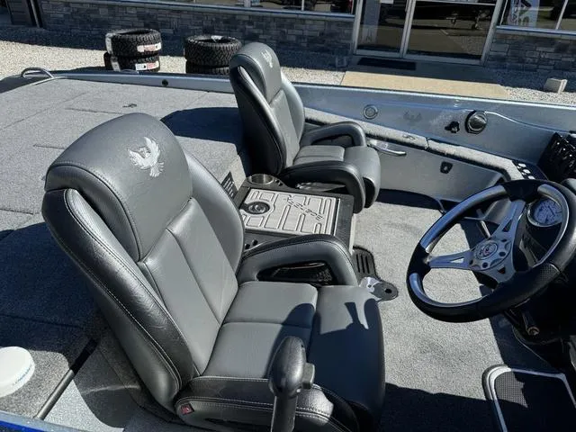 Slide: The Image of 2017 Phoenix 921 PRO XP boat interior with dual seats and steering wheel. - 6