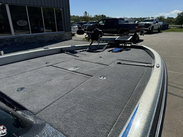 Slide: The Image of 2017 Phoenix 921 PRO XP boat deck in a parking lot, featuring storage compartments. - 7