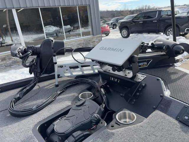 Slide: The Image of Boat dashboard with Garmin navigation system, iKon LX20, 2025 model, snowy outdoor setting. - 13