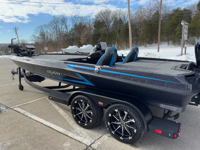 Slide: The Image of 2025 iKon LX20 boat with sleek design, parked on snowy roadside. - 20